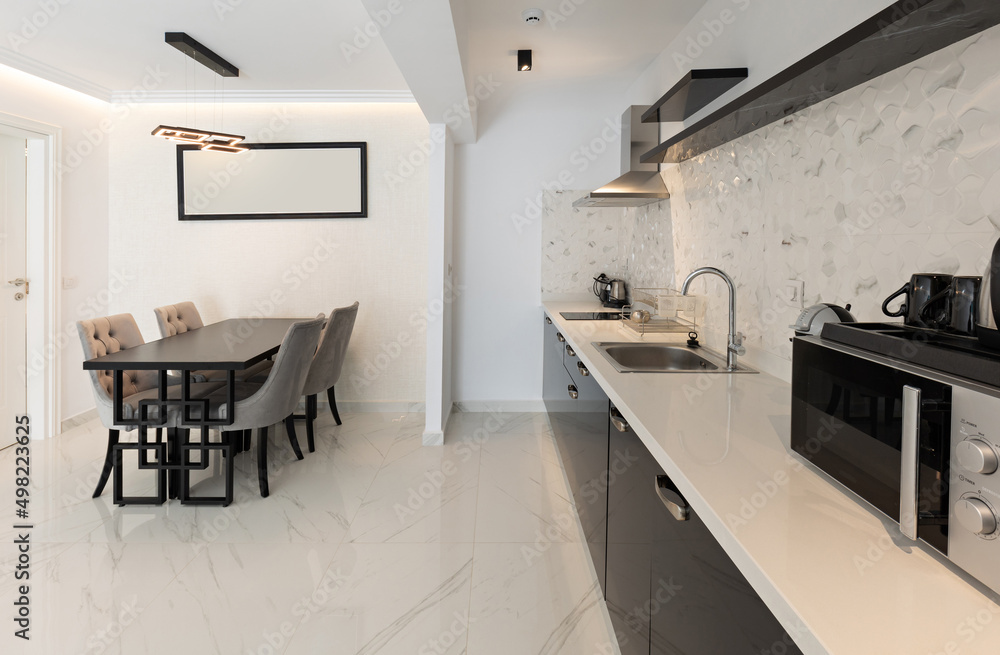 Interior of a modern new kitchen with dining table and chairs Interior of a modern new kitchen with dining table and chairs