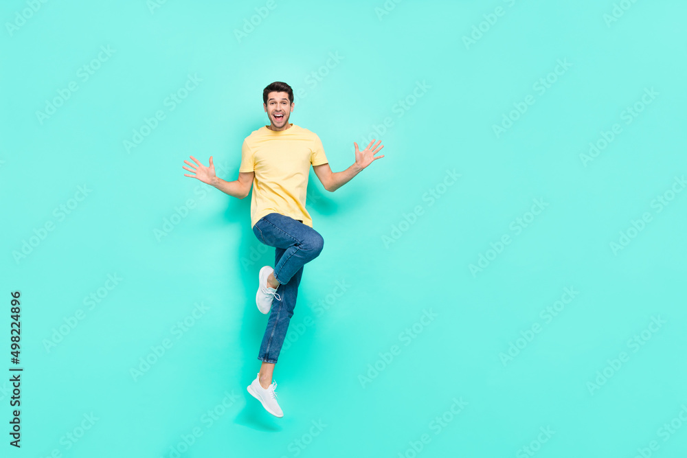 Full length portrait of astonished nice person arms palms open mouth isolated on teal color background