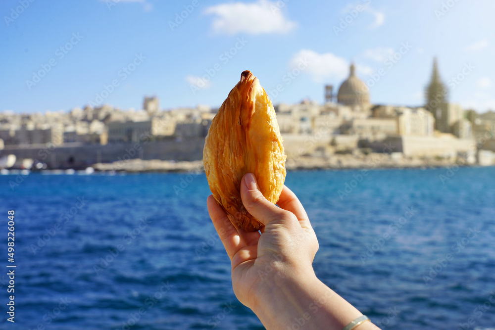 Obraz na płótnie Traditional savoury pastry Pastizzi from Malta with Valletta old town on background, Malta Island w salonie