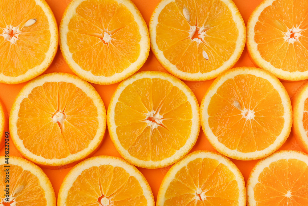 Background of fresh juicy orange slices with pits Background of fresh juicy orange slices with pits