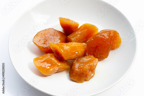 Sweet​ potato​ in syrup on white