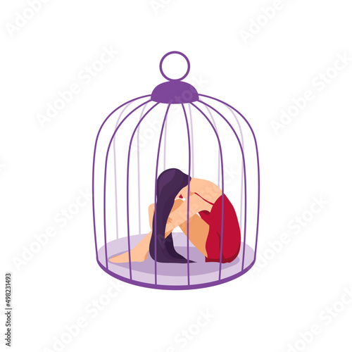 Woman hugging her knees sitting inside of the cage isolated on white background. Concept of captivity, helplessness and depression