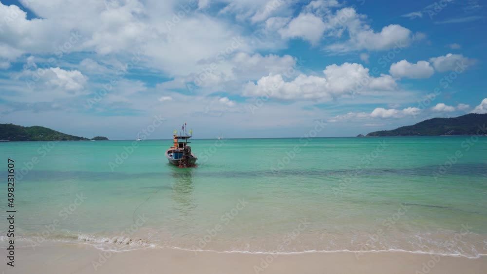 Long tail boat at Patong beach in Phuket, Thailand Long tail boat at Patong beach in Phuket, Thailand