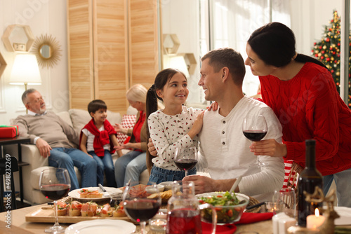 Happy family enjoying festive dinner at home. Christmas celebration