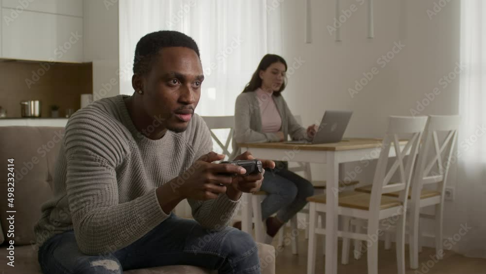 A young couple arguing about console gaming A young couple arguing about console gaming