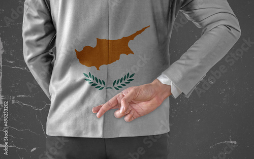 Businessman Jacket with Flag of Cyprus with his fingers crossed behind his back