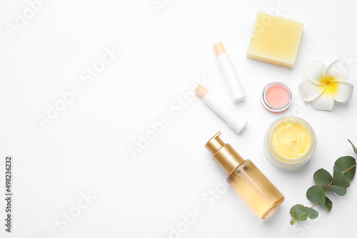 Flat lay composition with beeswax cosmetics on white background. Space for text