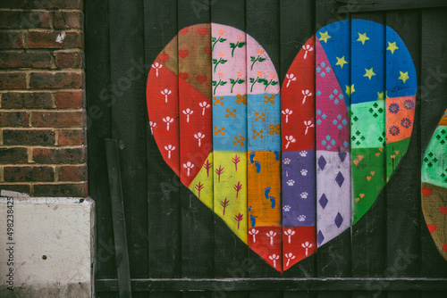 Shoreditch, London, UK - April 14, 2016: Colourful street art rendition of a heart, captured in Shoreditch, East London. photo