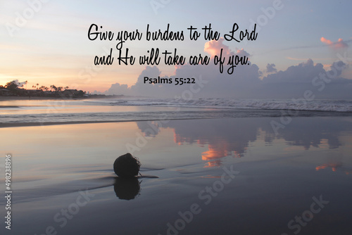 Bible verse inspirational quote - Give your burdens to the Lord and He will take care of you. Psalms 55:22 On tranquil morning light sunrise on the beach. Believe surrender to God concept. photo