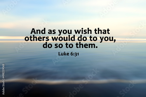 Bible verse inspiraitonal quote - And as you wish that others would do to you, do so to them. Luke 6:31 On blur smooth waves motion background on blue sea. Kindness and Christianity humanity concept. photo