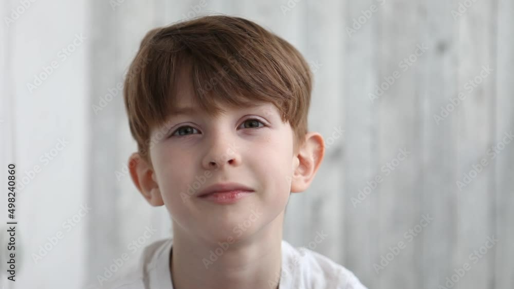 Boy toddler looking directly to camera and winks. Close up portait Boy toddler looking directly to camera and winks. Close up portait