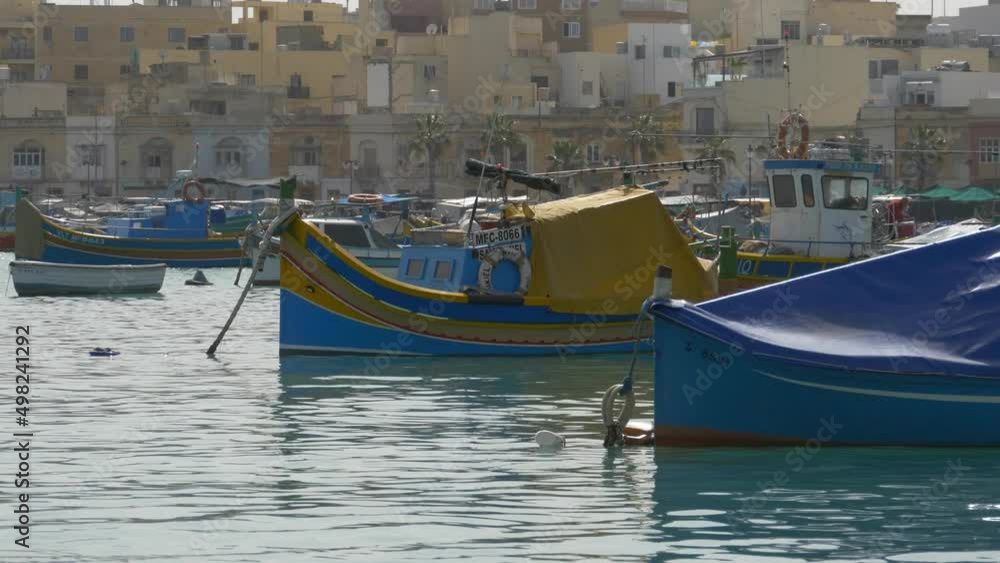Marsaxlokk, Malta with brightly painted boats Marsaxlokk, Malta with brightly painted boats