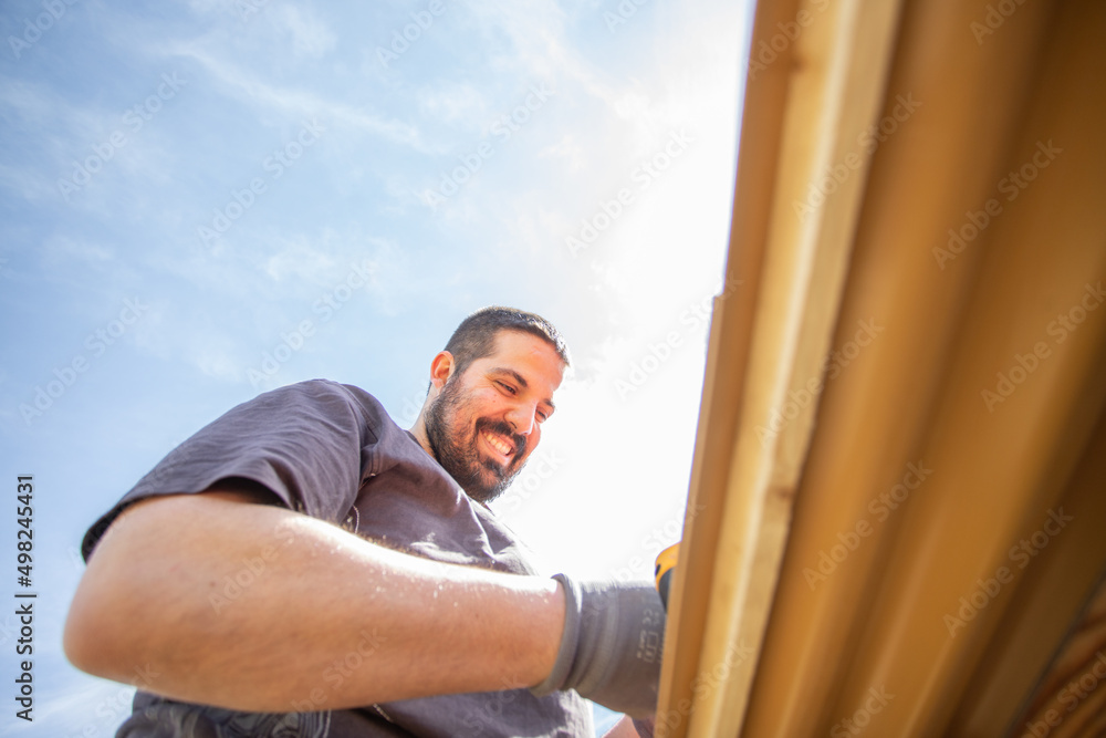 Fototapeta premium Happy caucasian man working outside