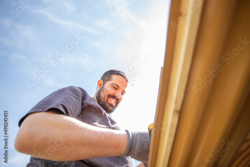 Happy caucasian man working outside