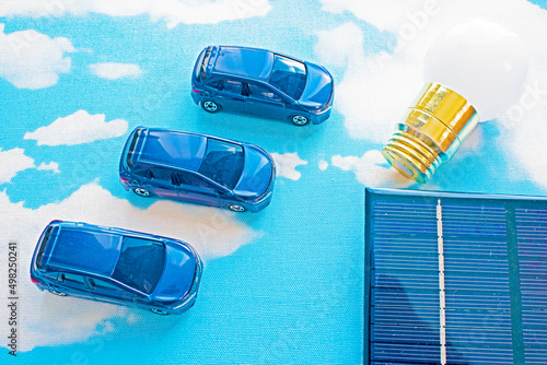 Wallpaper Mural blue sky and solar panel and light bulb and 3 cars Torontodigital.ca