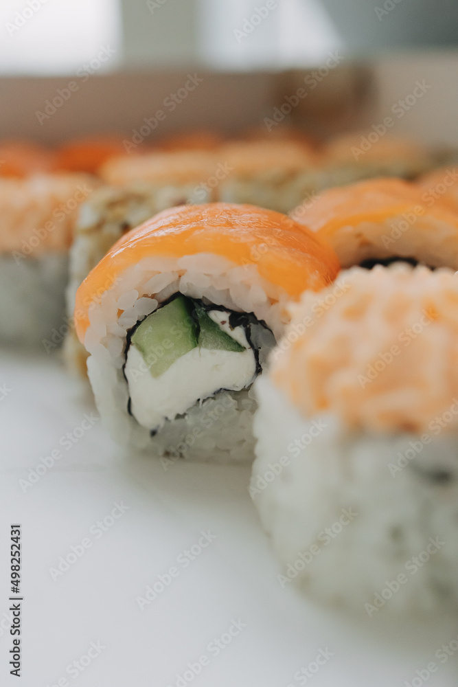 Philadelphia sushi with red fish and cucumber Philadelphia sushi with red fish and cucumber