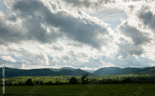 Landscape from Banat region in Romania, next to Timisoara. Summer landscape at the bottom of the hills during a cloudy day.