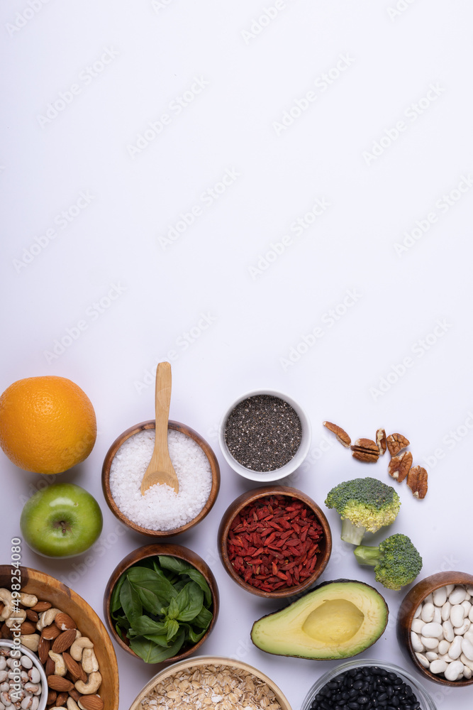 Directly above shot of various food and ingredient on white background, copy space Directly above shot of various food and ingredient on white background, copy space