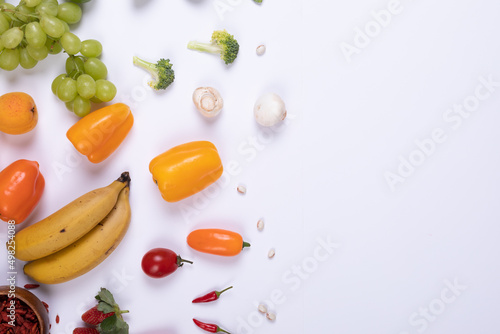 Directly above view of various food arranged on white background with copy space