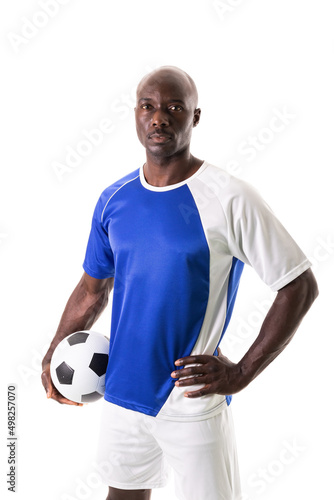 Portrait of confident male african american soccer player holding ball against white background