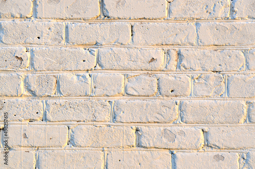Old white brick wall. Ancient stone texture background. Urban background, white ruined industrial brick wall with copy space. Home and office design backdrop. Vintage effect. 