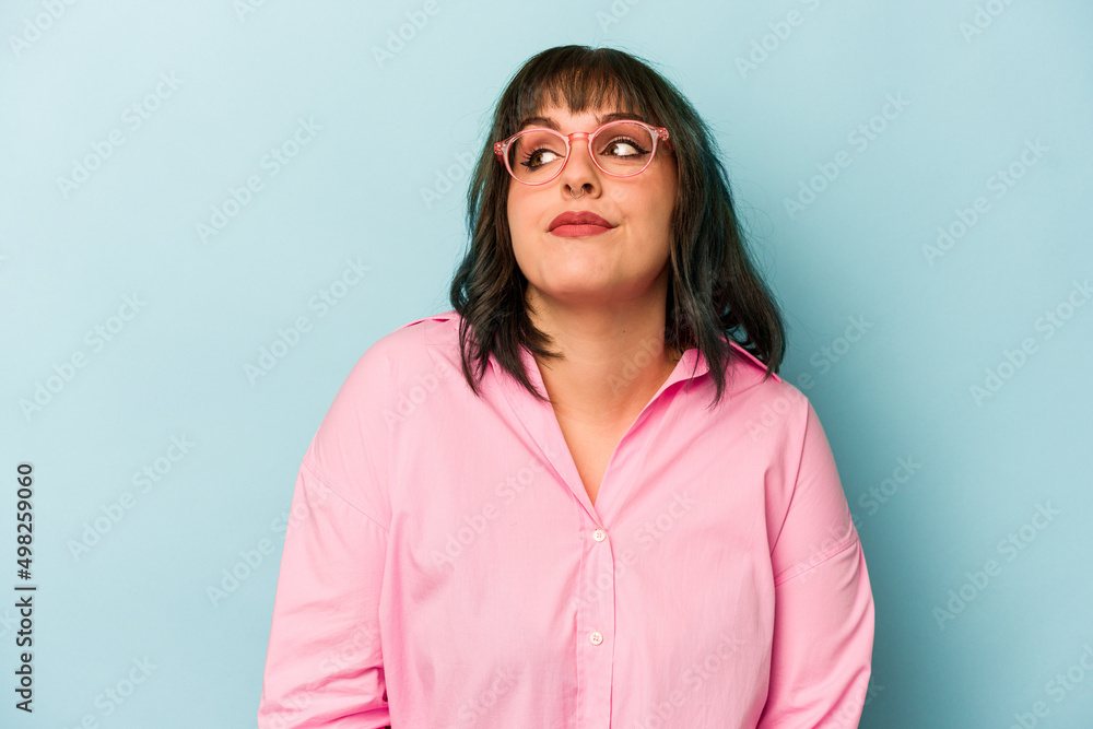 Young caucasian woman isolated on blue background dreaming of achieving goals and purposes Young caucasian woman isolated on blue background dreaming of achieving goals and purposes