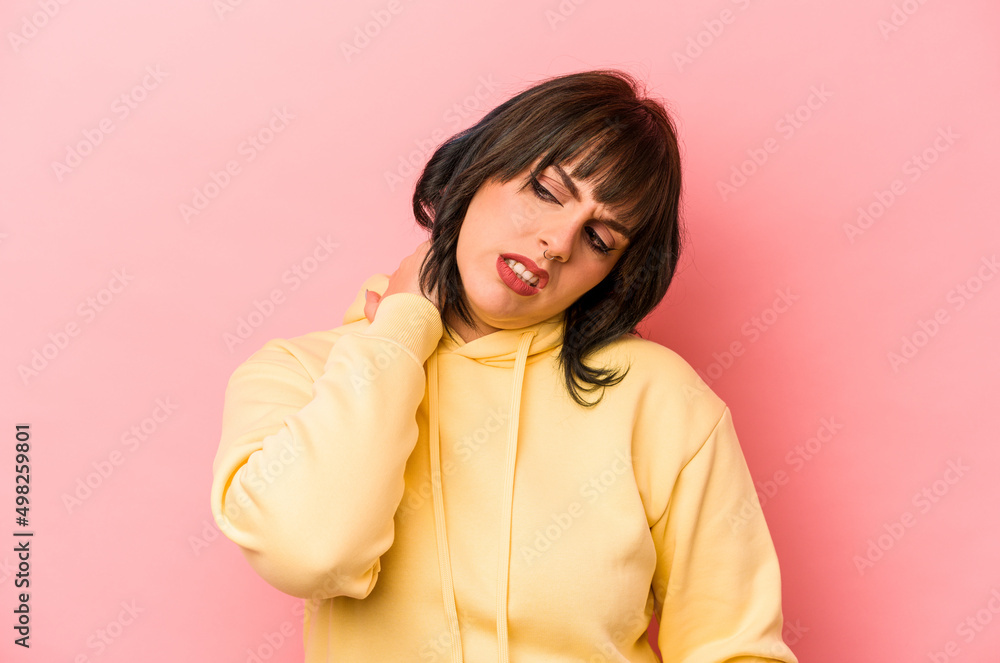 Young caucasian woman isolated on pink background suffering neck pain due to sedentary lifestyle. Young caucasian woman isolated on pink background suffering neck pain due to sedentary lifestyle.