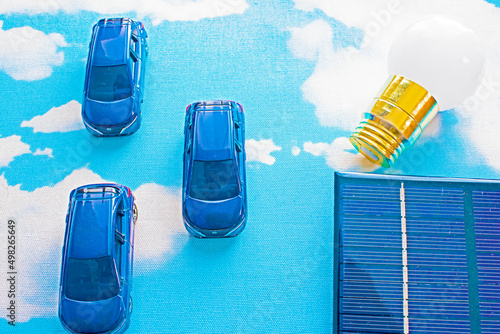 Wallpaper Mural blue sky and solar panel and light bulb and 3 cars Torontodigital.ca