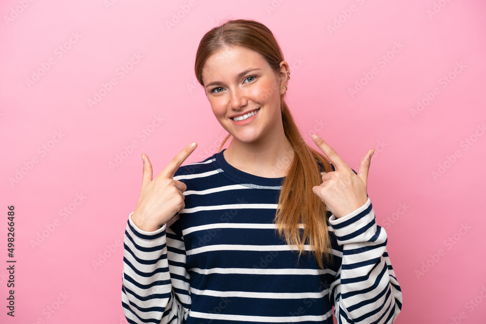 Young caucasian woman isolated on pink background giving a thumbs up gesture Young caucasian woman isolated on pink background giving a thumbs up gesture