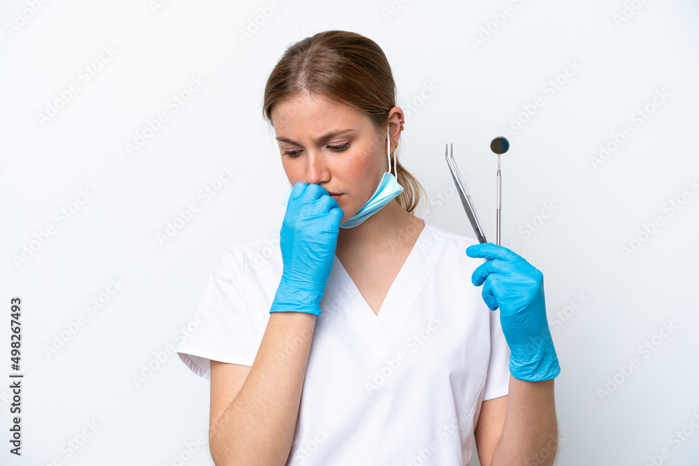 Dentist caucasian woman holding tools isolated on white background having doubts
