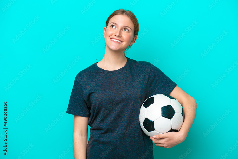 Young football player woman isolated on blue background thinking an idea while looking up Young football player woman isolated on blue background thinking an idea while looking up
