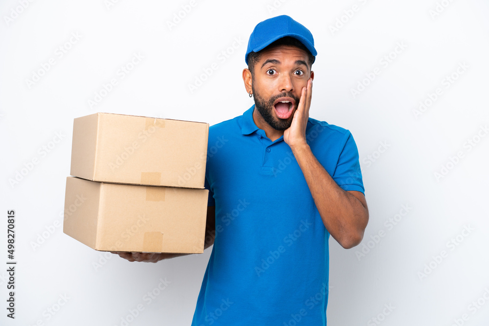 Delivery Brazilian man isolated on white background with surprise and shocked facial expression Delivery Brazilian man isolated on white background with surprise and shocked facial expression