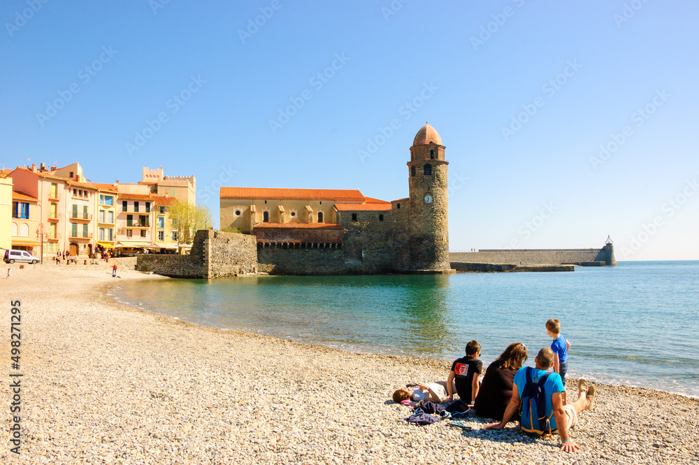 Collioure, France. Family (unrecognizable people, back view) relaxing