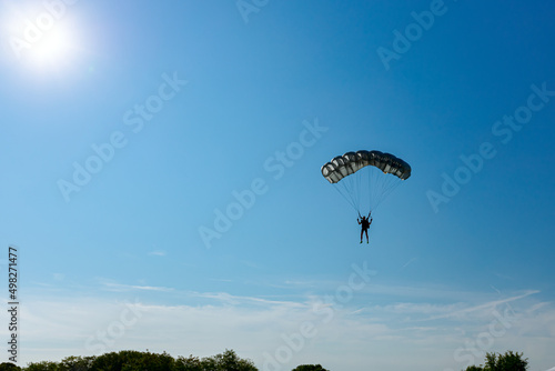 Skydiver jumper is landing with parachute