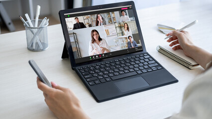 Business webinar. Video chat. Distance education. Woman watching online lesson with female coach speaking diverse students listening on laptop screen in virtual class.