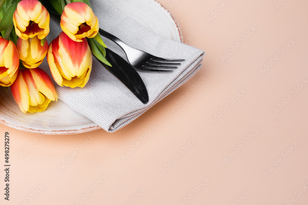 Festive Table Setting With Tulips. Holiday Table Set for Birthday, Mother's Day or for another holiday. Festive Table Setting With Tulips. Holiday Table Set for Birthday, Mother's Day or for another holiday.