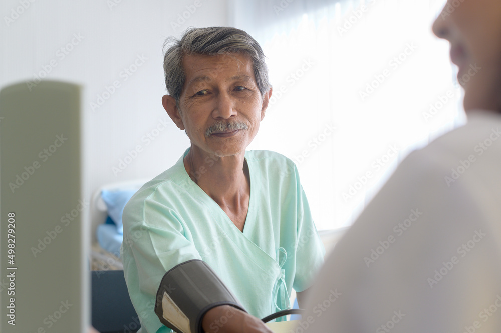 Asian senior male patient is consulting and visiting doctor in hospital.... Asian senior male patient is consulting and visiting doctor in hospital....