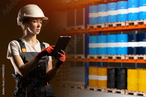 Oil warehouse. Woman manage...
