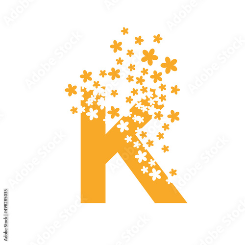 The letter K dissolves into a cloud of flowers