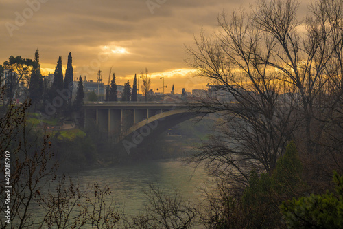 Blazo Jovanovic Bridge over the river Moraca in Podgorica, capital of Montenegro. evening, winter, sunset, dawn