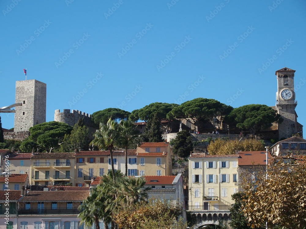 View of the Castle Hill and Castle of Cannes, France, with the tower of the Notre-Dame de l'Esperance church on the right