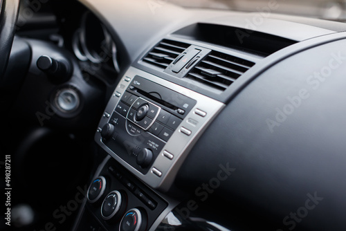 Close-up of air vent in car. Dashboard in modern car interior.