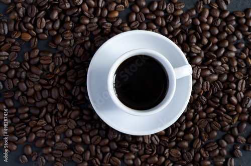 Top View of White Coffee Cup Surrounded with Coffee Beans