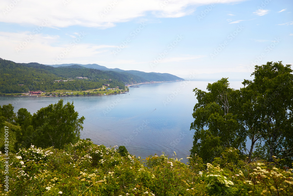 Angara River, Lake Baikal. View from the mountain at the port of Baikal to the village of Listvyanka on a summer day.