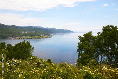 Angara River, Lake Baikal. View from the mountain at the port of Baikal to the village of Listvyanka on a summer day.