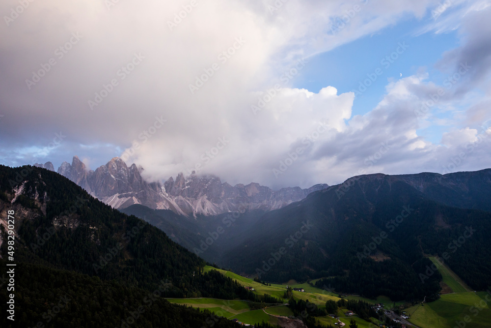 Sunset and rainbow in Val Di Funes, Dolomites, Alps, Italy