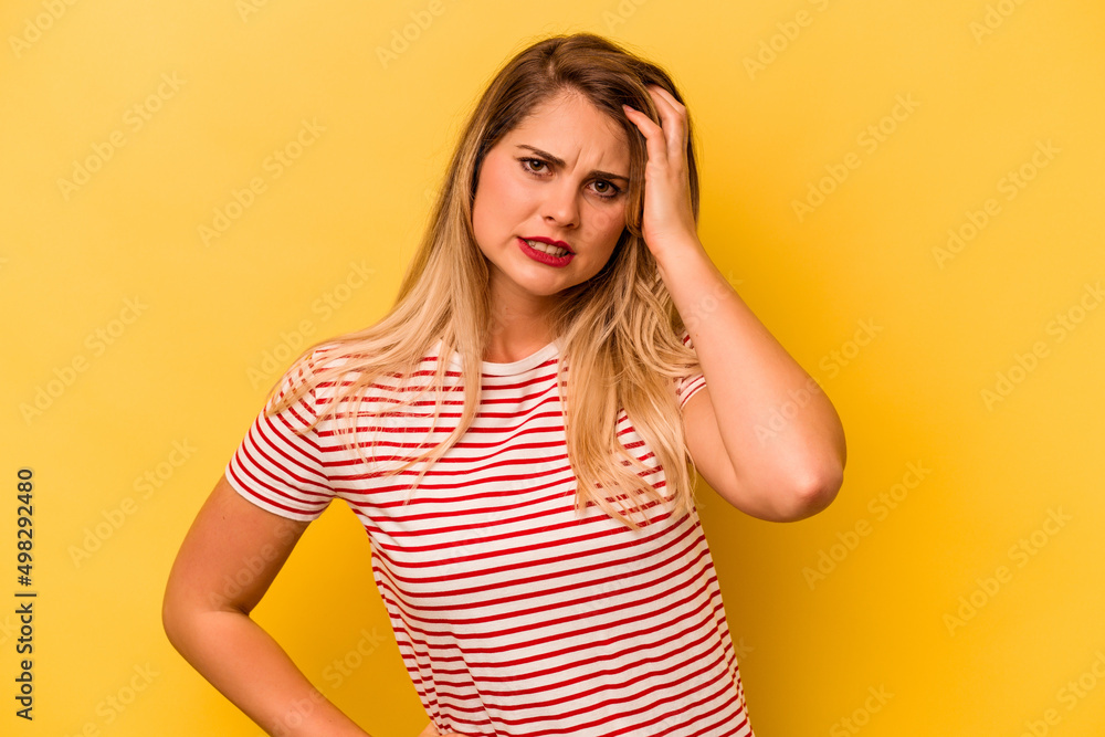 Young caucasian woman isolated on yellow background tired and very sleepy keeping hand on head. Young caucasian woman isolated on yellow background tired and very sleepy keeping hand on head.