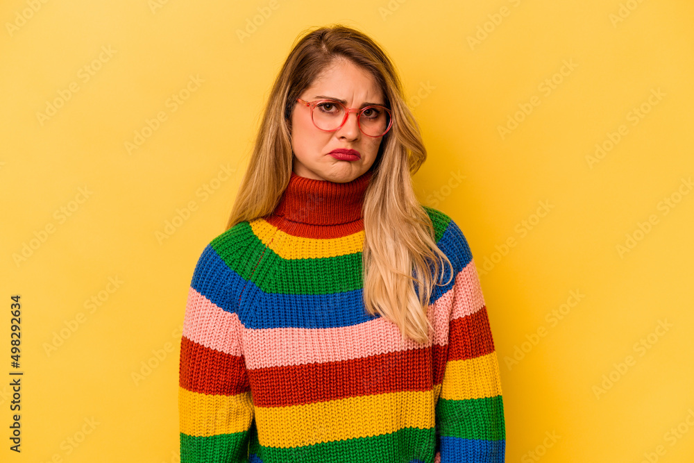 Young caucasian woman isolated on yellow background sad, serious face, feeling miserable and displeased. Young caucasian woman isolated on yellow background sad, serious face, feeling miserable and displeased.