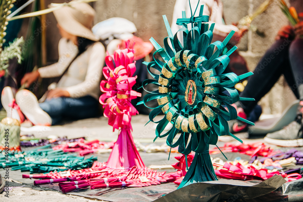 Fototapeta premium Palm leaf figures for sale during Palm Sunday