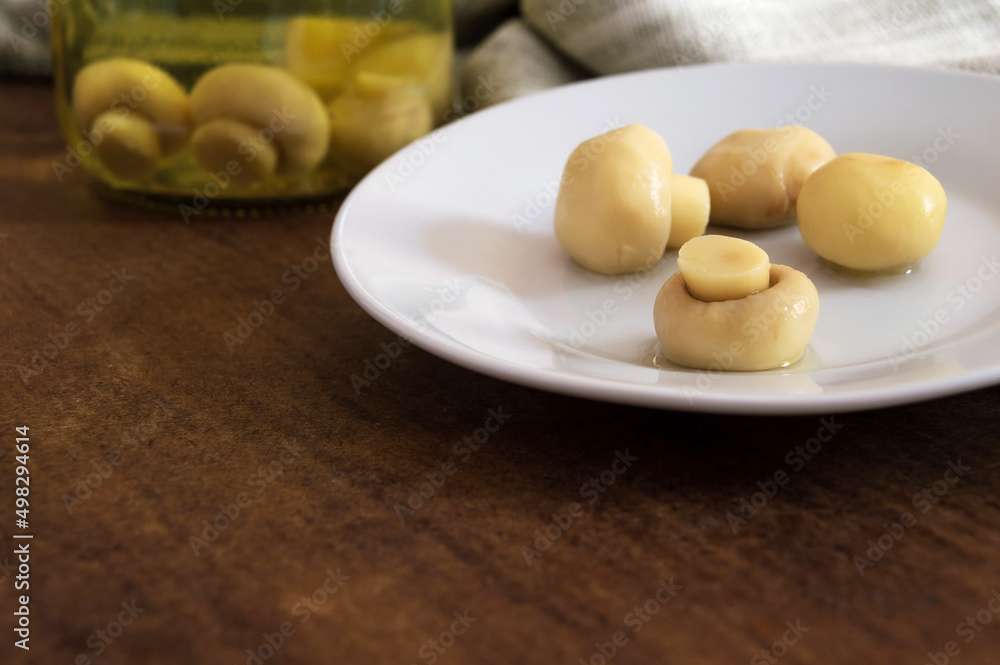 four mushrooms exposed on white plate